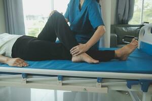 Physiotherapist working with patient in clinic, closeup photo