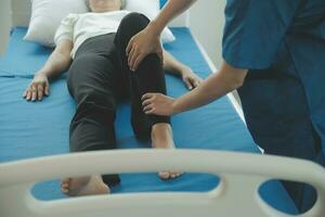 Physiotherapist working with patient in clinic, closeup photo