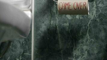 Messages written on a roll of toilet paper -Game over video