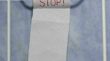 Messages written on a roll of toilet paper - Stop video