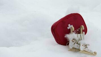 Winter sport equipment and first aid kit in the snow video