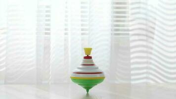 colorida fiação topo comovente em uma mesa com transparente cortina em a fundo. video