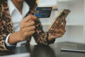 Concept online payment with cradit card. Hand of men using laptop for to payment make online health insurance. photo