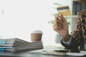 Concept online payment with cradit card. Hand of men using laptop for to payment make online health insurance. photo