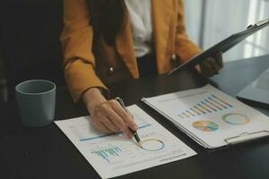 Audit concept,Administrator business man financial inspector and secretary making report calculating balance. Internal Revenue Service checking document. photo