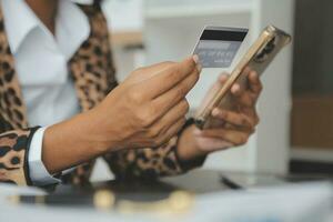 Concept online payment with cradit card. Hand of men using laptop for to payment make online health insurance. photo