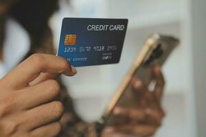 Concept online payment with cradit card. Hand of men using laptop for to payment make online health insurance. photo