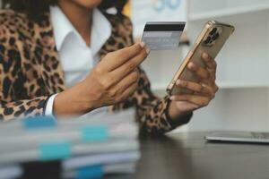 Concept online payment with cradit card. Hand of men using laptop for to payment make online health insurance. photo