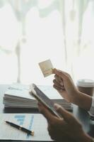 Concept online payment with cradit card. Hand of men using laptop for to payment make online health insurance. photo