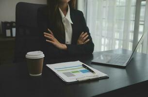 Audit concept,Administrator business man financial inspector and secretary making report calculating balance. Internal Revenue Service checking document. photo