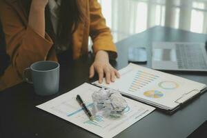 Audit concept,Administrator business man financial inspector and secretary making report calculating balance. Internal Revenue Service checking document. photo
