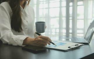 Audit concept,Administrator business man financial inspector and secretary making report calculating balance. Internal Revenue Service checking document. photo