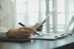 Audit concept,Administrator business man financial inspector and secretary making report calculating balance. Internal Revenue Service checking document. photo