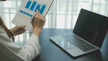 Audit concept,Administrator business man financial inspector and secretary making report calculating balance. Internal Revenue Service checking document. photo