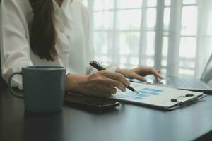Audit concept,Administrator business man financial inspector and secretary making report calculating balance. Internal Revenue Service checking document. photo