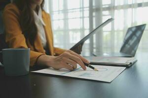 Audit concept,Administrator business man financial inspector and secretary making report calculating balance. Internal Revenue Service checking document. photo