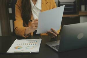 Audit concept,Administrator business man financial inspector and secretary making report calculating balance. Internal Revenue Service checking document. photo