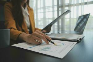 Audit concept,Administrator business man financial inspector and secretary making report calculating balance. Internal Revenue Service checking document. photo