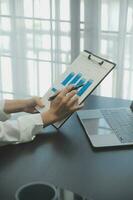 Audit concept,Administrator business man financial inspector and secretary making report calculating balance. Internal Revenue Service checking document. photo