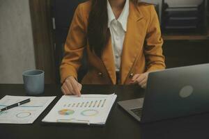Audit concept,Administrator business man financial inspector and secretary making report calculating balance. Internal Revenue Service checking document. photo