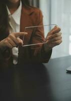 Shot of a asian young business Female working on laptop in her workstation. photo