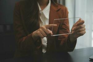 Shot of a asian young business Female working on laptop in her workstation. photo