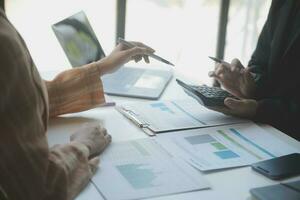 Audit concept,Administrator business man financial inspector and secretary making report calculating balance. Internal Revenue Service checking document. photo