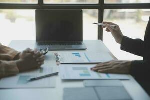 Audit concept,Administrator business man financial inspector and secretary making report calculating balance. Internal Revenue Service checking document. photo