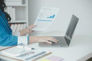 Audit concept,Administrator business man financial inspector and secretary making report calculating balance. Internal Revenue Service checking document. photo