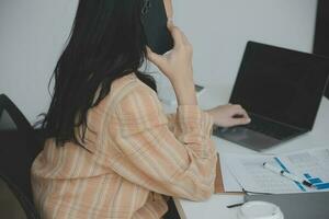 Audit concept,Administrator business man financial inspector and secretary making report calculating balance. Internal Revenue Service checking document. photo