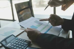 Audit concept,Administrator business man financial inspector and secretary making report calculating balance. Internal Revenue Service checking document. photo