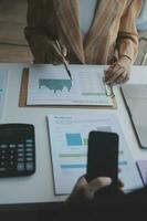 Audit concept,Administrator business man financial inspector and secretary making report calculating balance. Internal Revenue Service checking document. photo