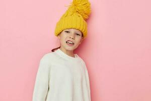 cute girl in a sweater and a hat childhood unaltered photo