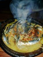 Tasty fish and potato tagine with its smoky flavor photo