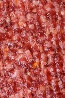Fresh raw ground beef burger patty with salt and spices photo