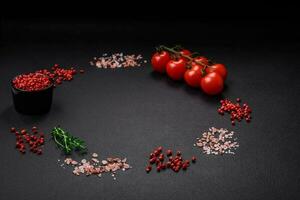 Ingredients for cooking cherry tomatoes, salt, spices and herbs photo