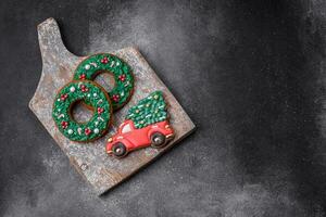 Delicious beautiful Christmas gingerbread cookies on a textured concrete background photo
