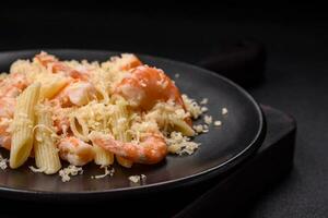 Delicious fresh penna pasta with shrimp, sauce, cheese, salt and spices photo