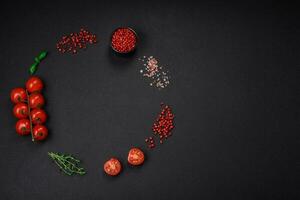 Ingredients for cooking cherry tomatoes, salt, spices and herbs photo