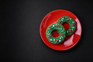 Beautiful bright colorful homemade gingerbread cookies on a ceramic plate photo