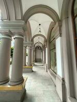 Arches and columns of an ancient building in the central part of the city photo