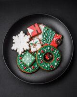 Delicious fresh colorful Christmas or New Year gingerbread cookies photo