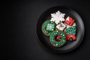 Delicious fresh colorful Christmas or New Year gingerbread cookies photo