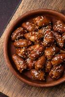 Chicken hearts fried in soy sauce with salt and spices in a plate photo