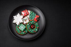 Delicious fresh colorful Christmas or New Year gingerbread cookies photo