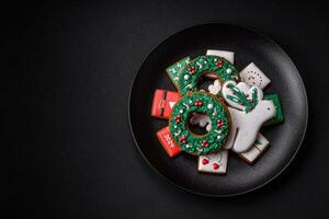 Delicious fresh colorful Christmas or New Year gingerbread cookies photo