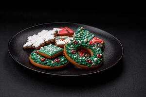 Delicious fresh colorful Christmas or New Year gingerbread cookies photo