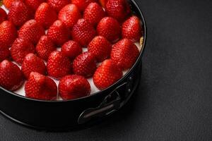 Delicious sweet cake or cheesecake with mascarpone cheese and strawberries photo