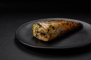Delicious grilled ocean mackerel with salt, spices and herbs photo