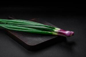 Fresh green onions for cooking a healthy vegetarian dish photo